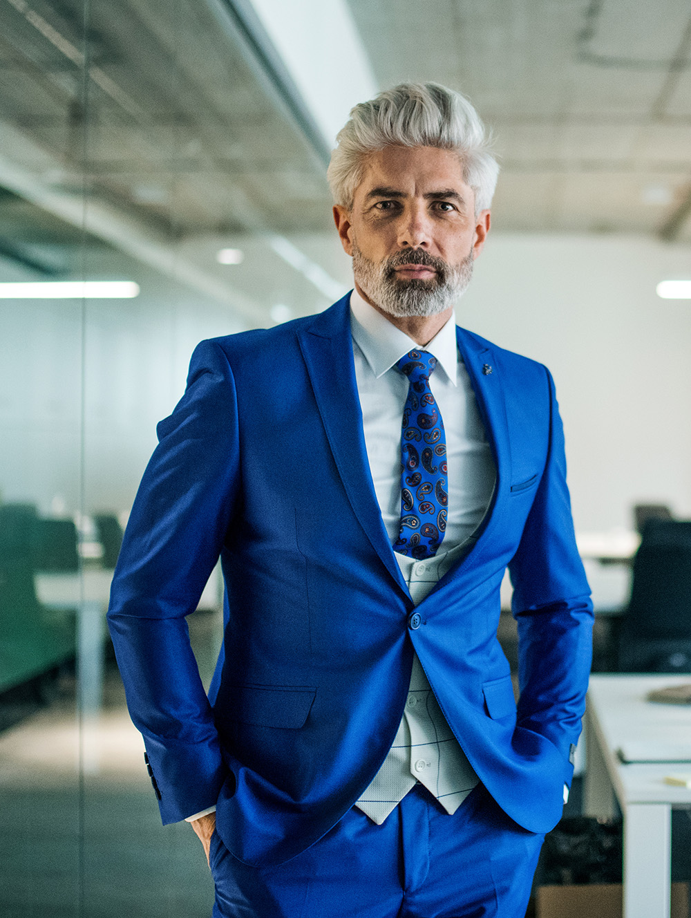 a-portrait-of-mature-businessman-standing-in-an-of-2023-11-27-05-02-47-utc